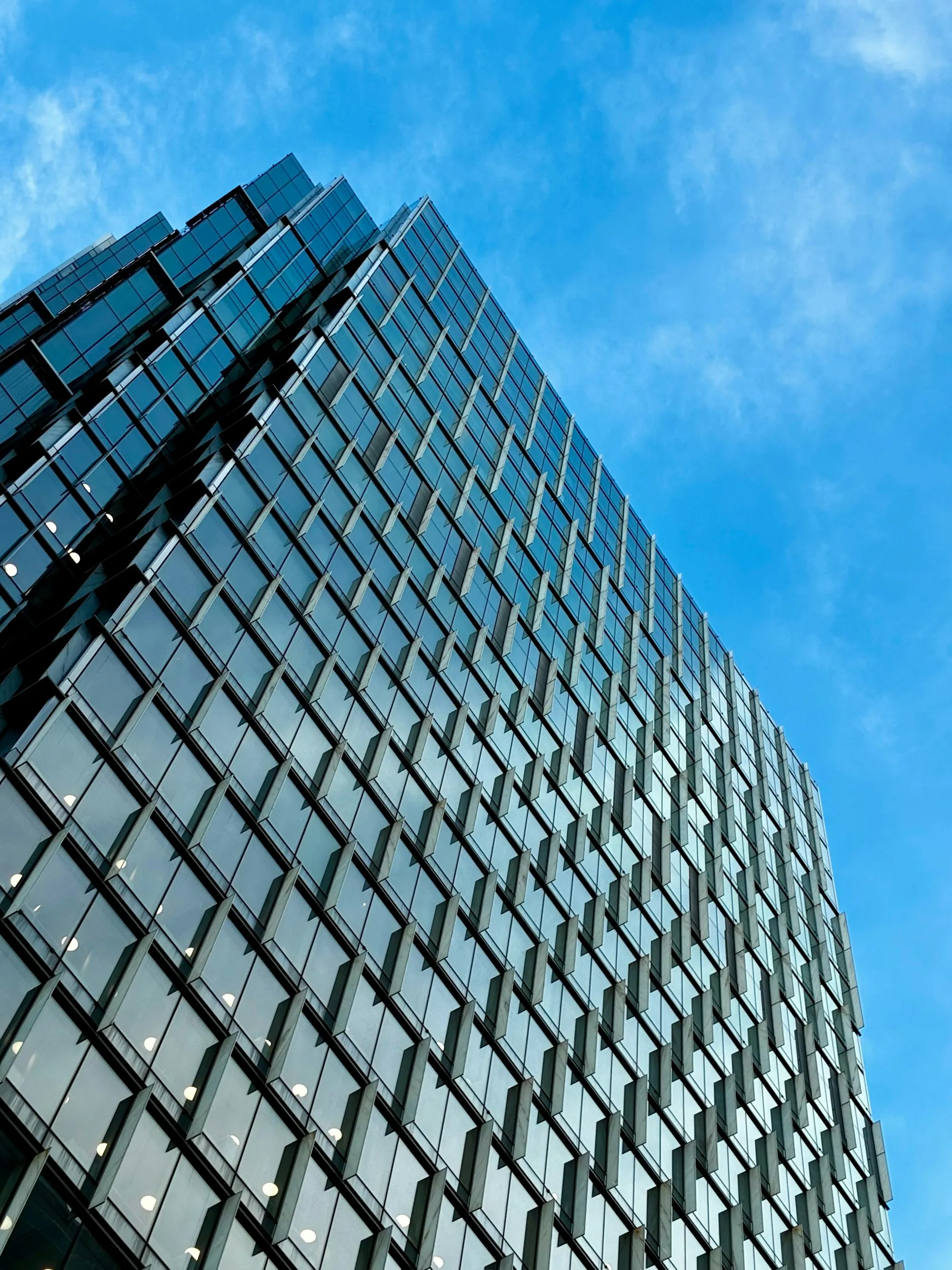 Glass office building facade from a low angle
