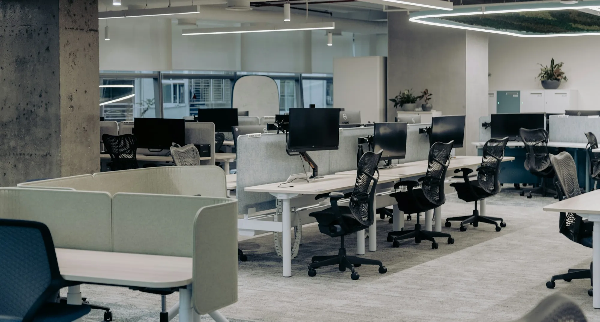 Office workstations with ergonomic chairs